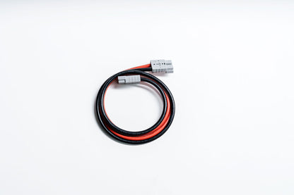 Luffare 2m Anderson Extension Cable unpacked — grey Anderson SB50 plug on each end of a 6AWG red and black 12V cable, neatly coiled on a white background