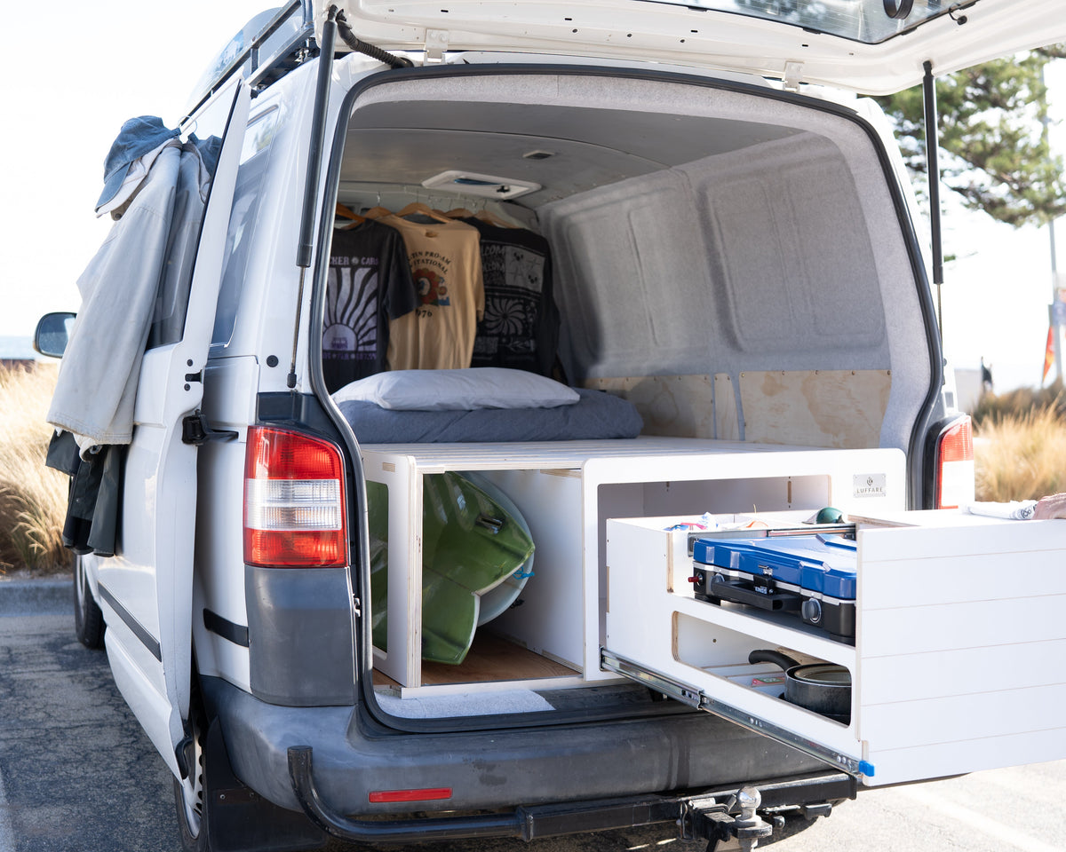 Surfboard storage under slide-out